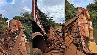 Ponte de madeira cede e carreta com milho tomba em rio na MS-455